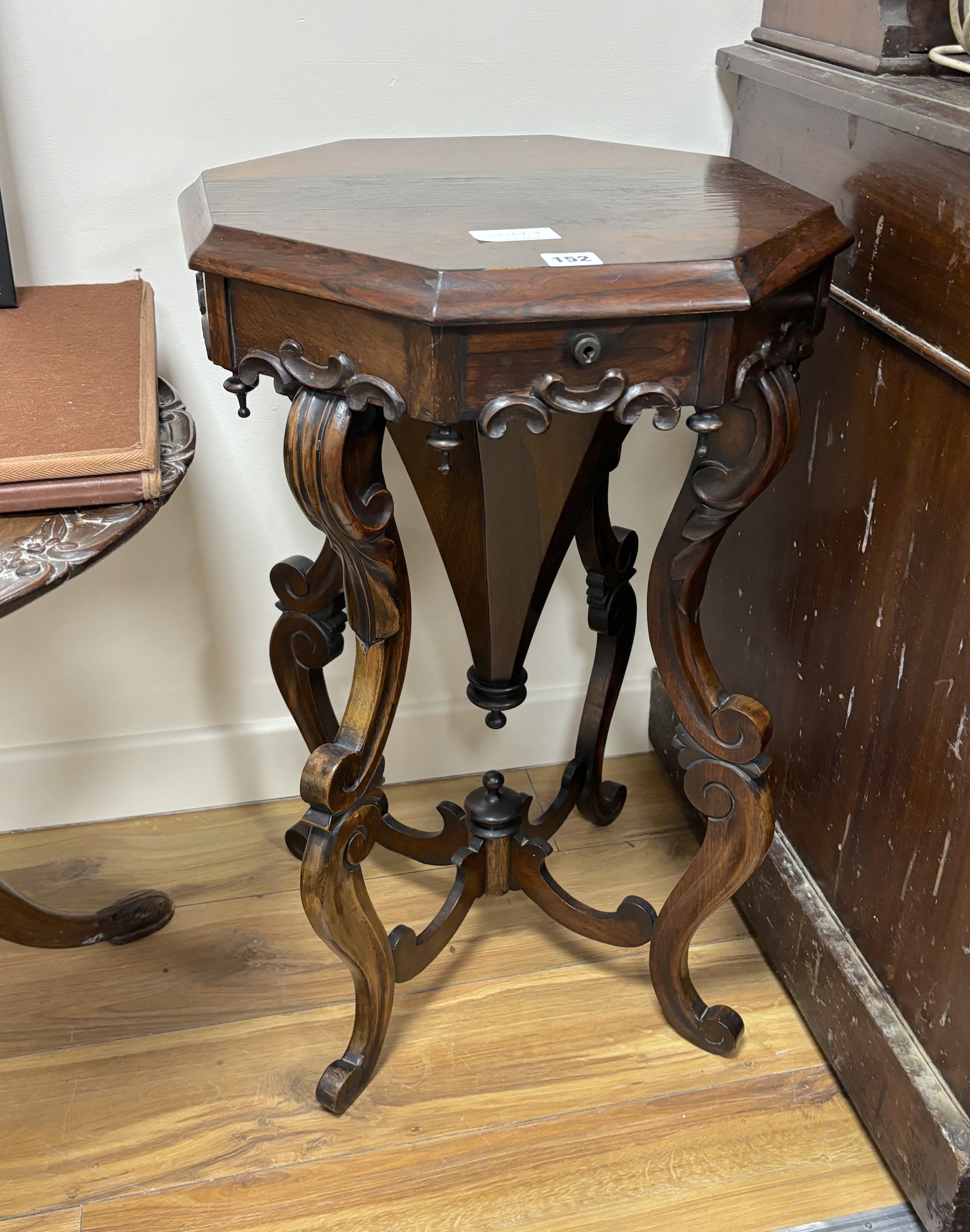 A Victorian octagonal rosewood work table, width 44cm, height 69cm